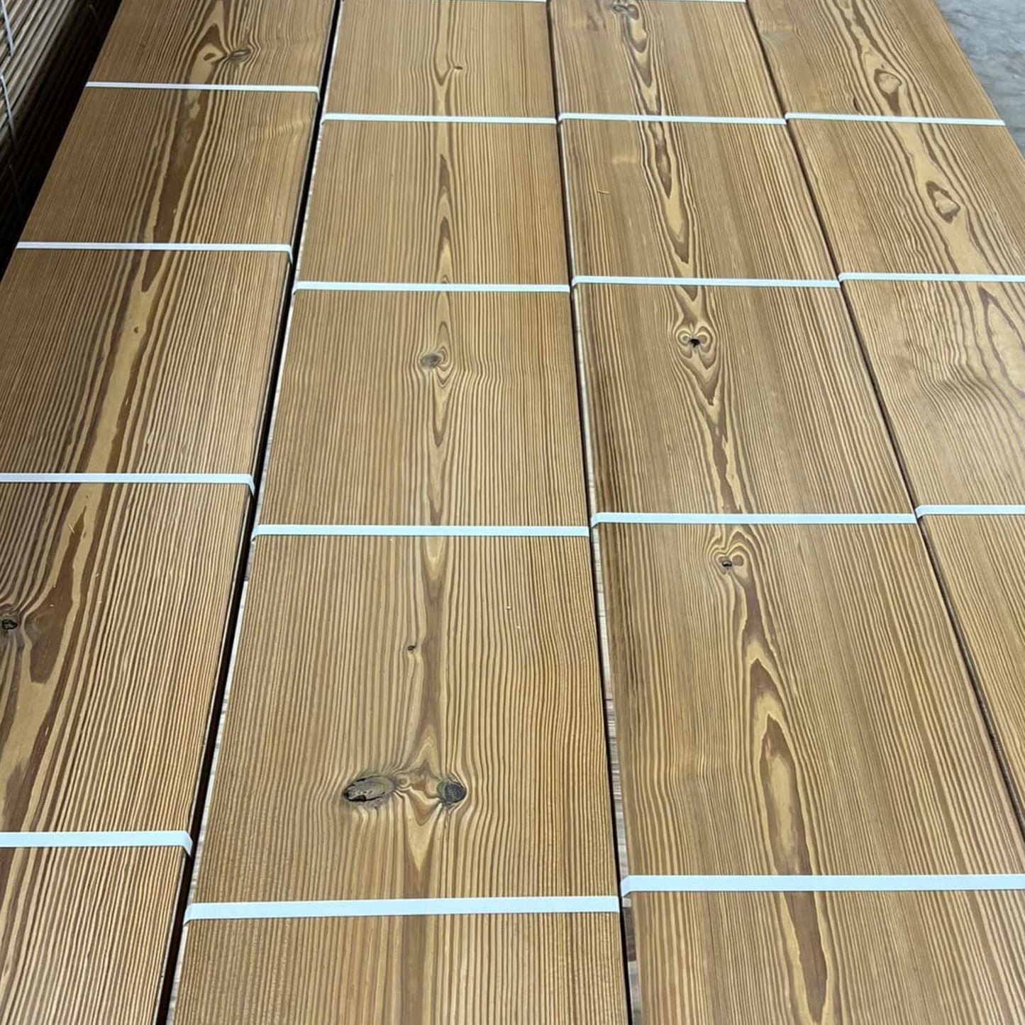 Waterproof solid wood for showers and wet areas. Real White Oak, Antique Heart Pine, and Cypress — made for high-humidity spaces.