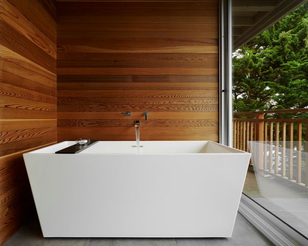 Waterproof solid thermally modified wood used as real-wood shower wall planking.